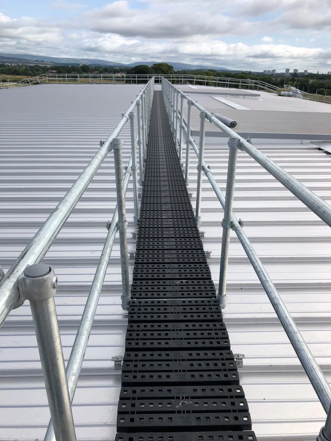 Rooftop walkway with guardrail