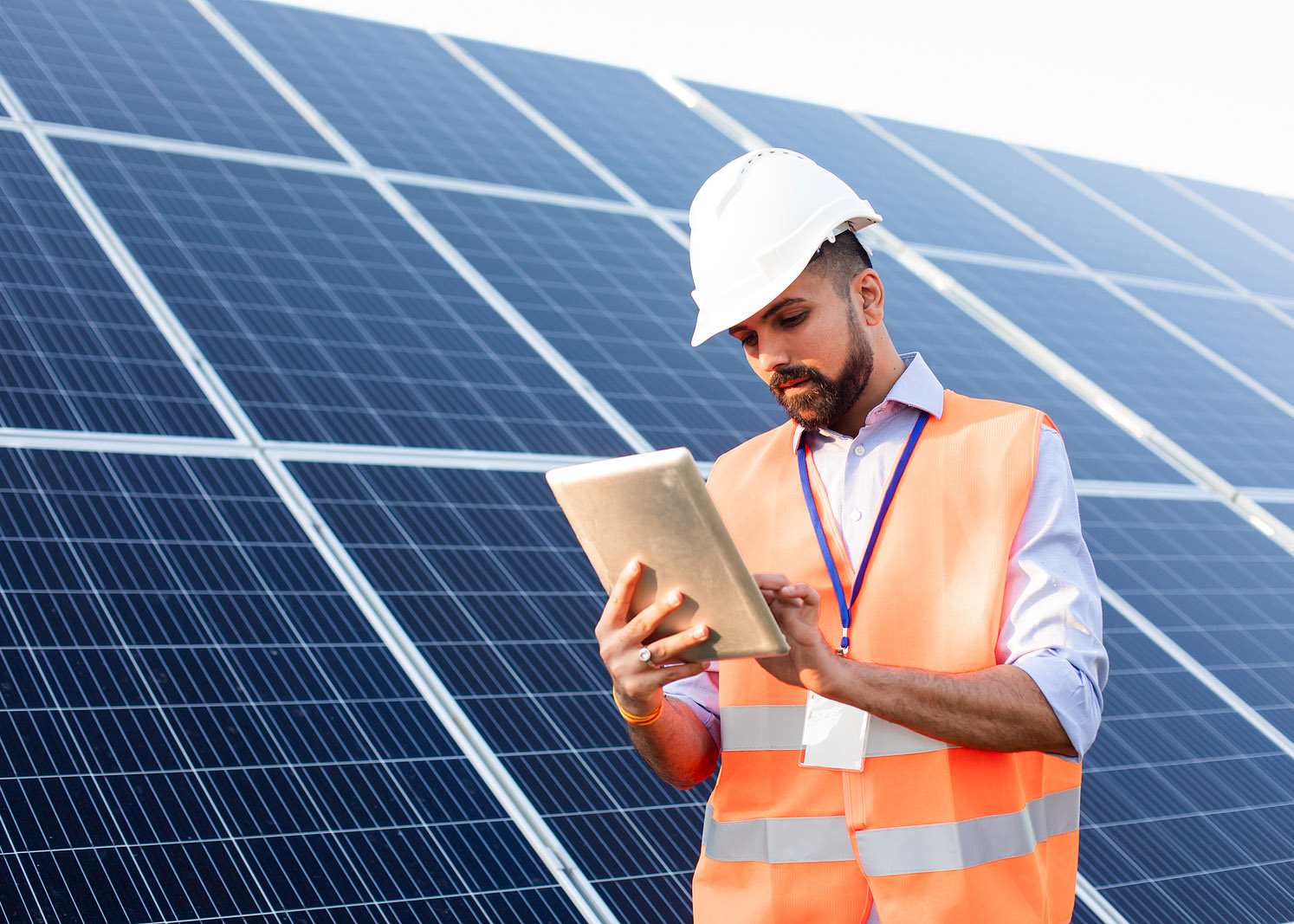 Engineer With A Tablet Solar Panels