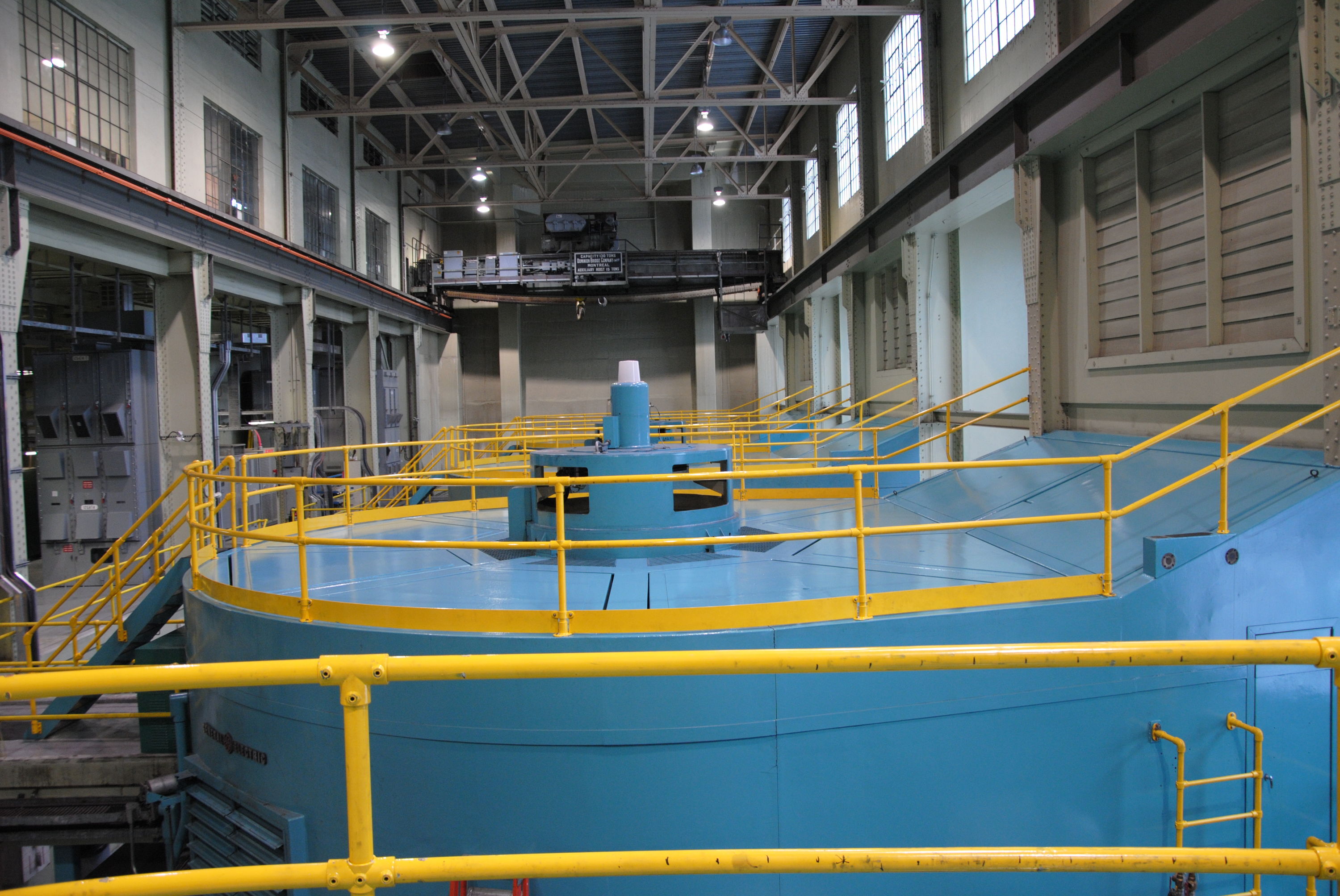 Modular safety railings surrounding warehouse equipment